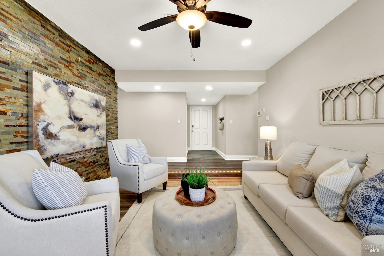 314 Tulip Street Fairfield, CA 94533 - Photo 5 of 11 a living room with furniture and a chandelier
