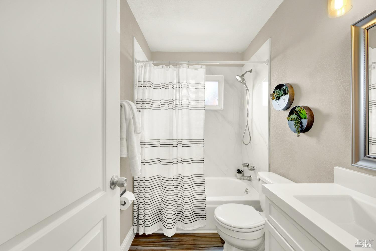314 Tulip Street Fairfield, CA 94533 - Photo 9 of 11 a bathroom with a sink toilet and shower