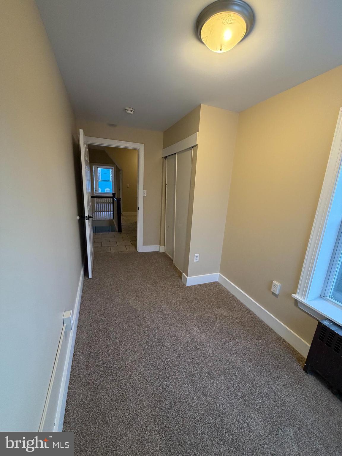 1255 Buttonwood Street Reading, PA 19604 - Photo 9 of 14 an empty room with a window