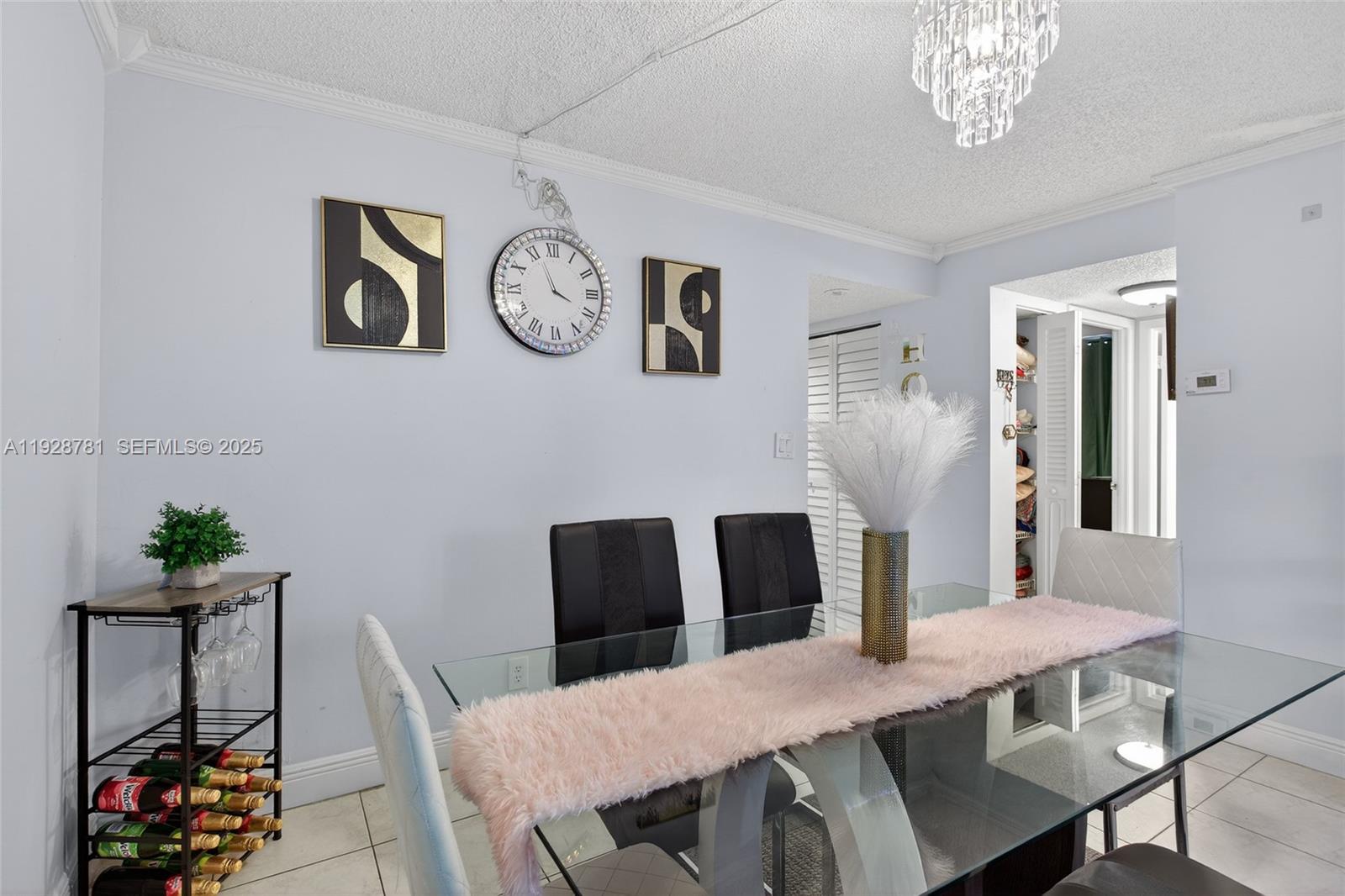 6195 Rock Island Road, Unit 103 Tamarac, FL 33319 - Photo 20 of 27 a view of a dining room with furniture and wooden floor