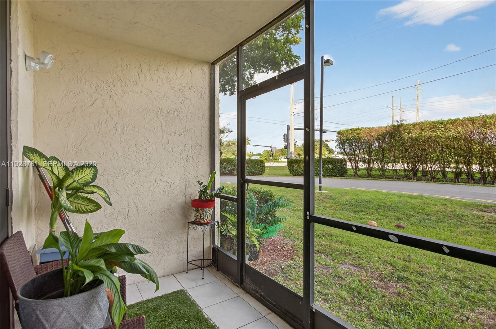 6195 Rock Island Road, Unit 103 Tamarac, FL 33319 - Photo 23 of 27 a view of a porch with a potted plant