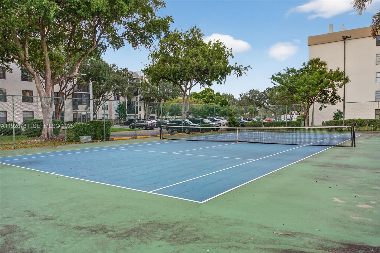 6195 Rock Island Road, Unit 103 Tamarac, FL 33319 - Photo 25 of 27 a view of outdoor space and tennis court