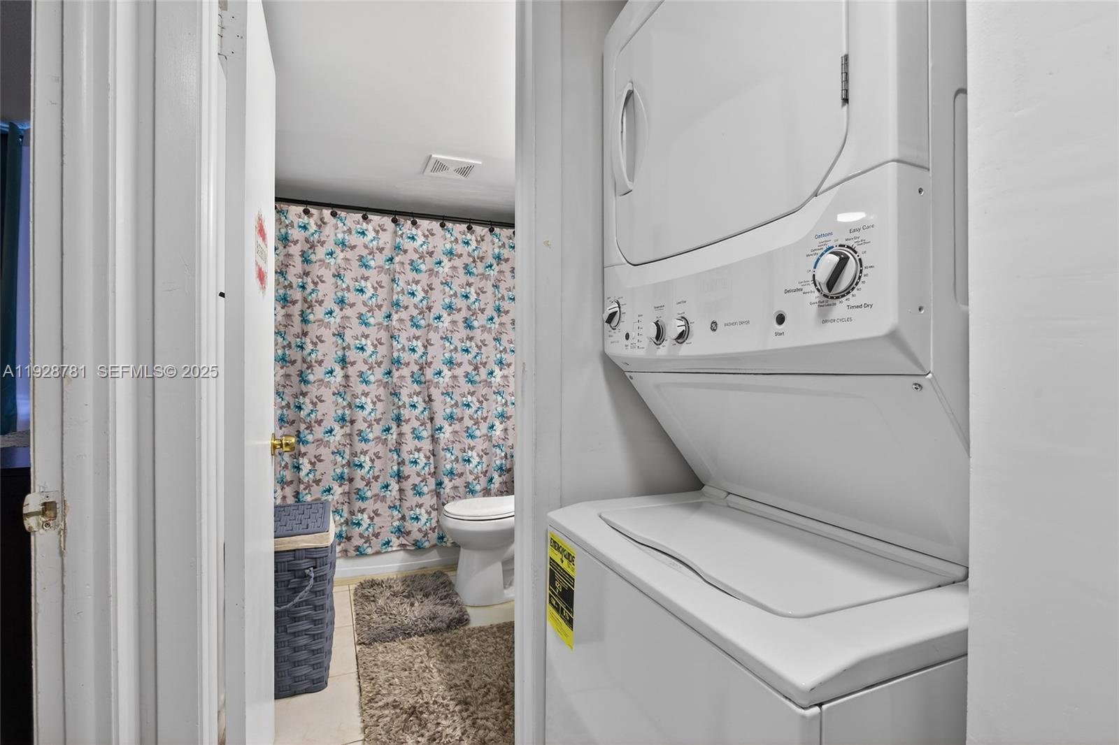 6195 Rock Island Road, Unit 103 Tamarac, FL 33319 - Photo 9 of 27 a bathroom with a toilet and a shower