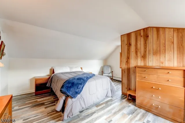 a bed room with a bed and a window