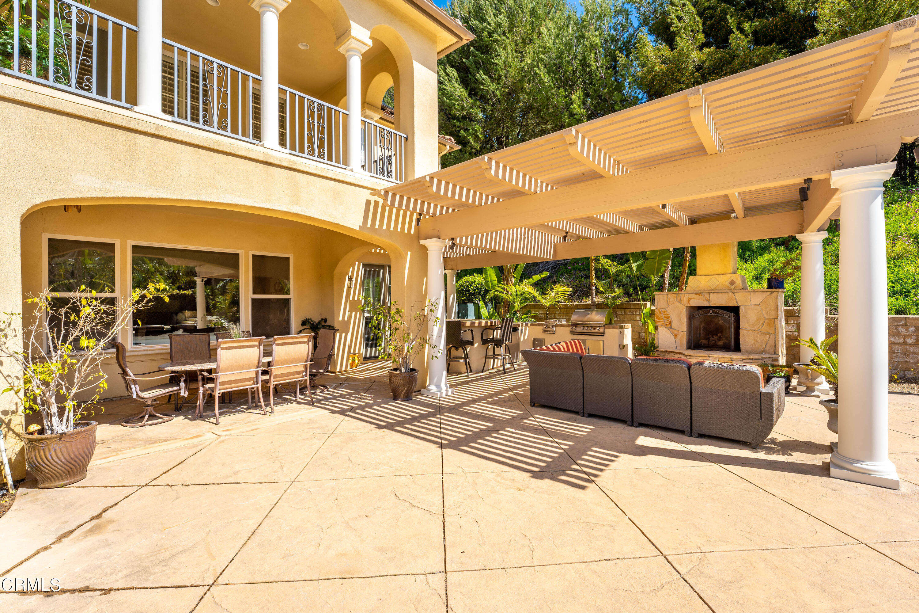 2510 Worth Way Camarillo, CA 93012 - Photo 16 of 75 a view of a patio with table and chairs with wooden floor and plants