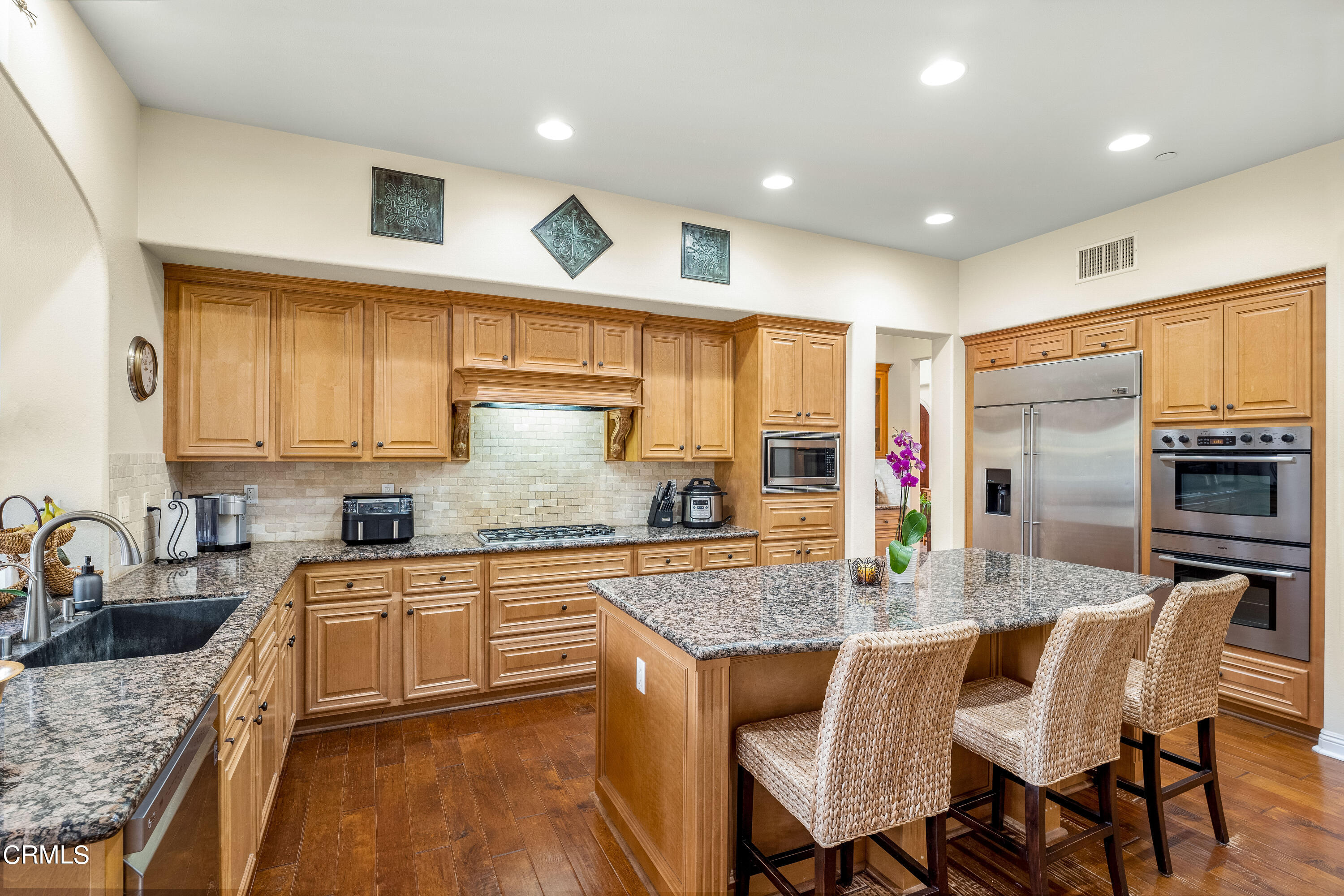 2510 Worth Way Camarillo, CA 93012 - Photo 29 of 75 a kitchen with granite countertop lots of counter top space and stainless steel appliances