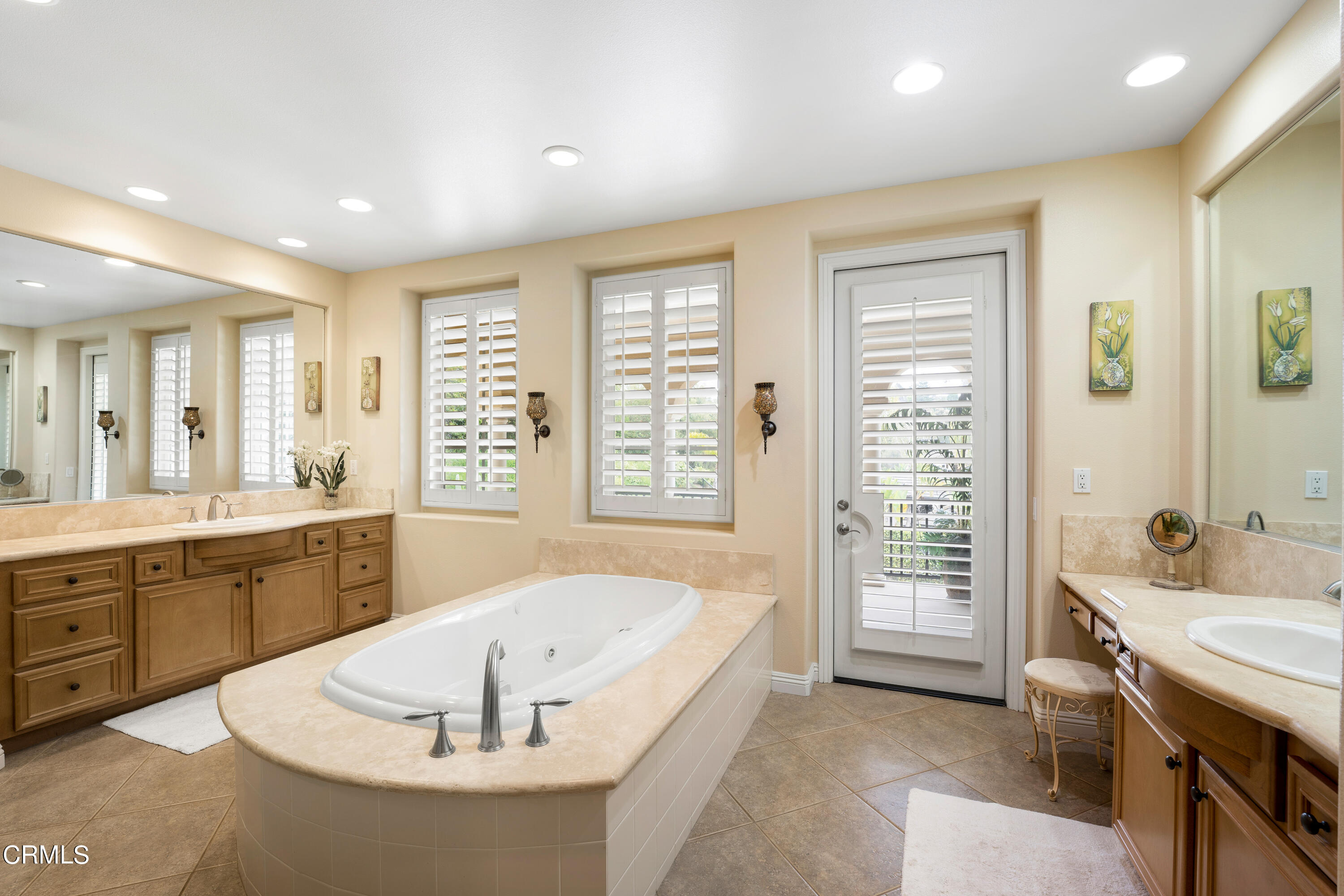 2510 Worth Way Camarillo, CA 93012 - Photo 51 of 75 a spacious bathroom with a granite countertop tub sink and mirror