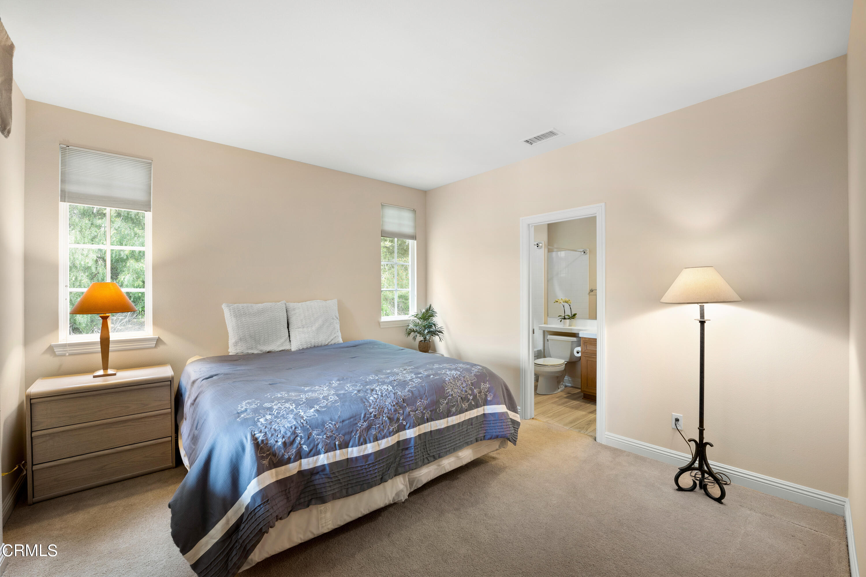 2510 Worth Way Camarillo, CA 93012 - Photo 65 of 75 a bedroom with a bed a table and painting on the wall