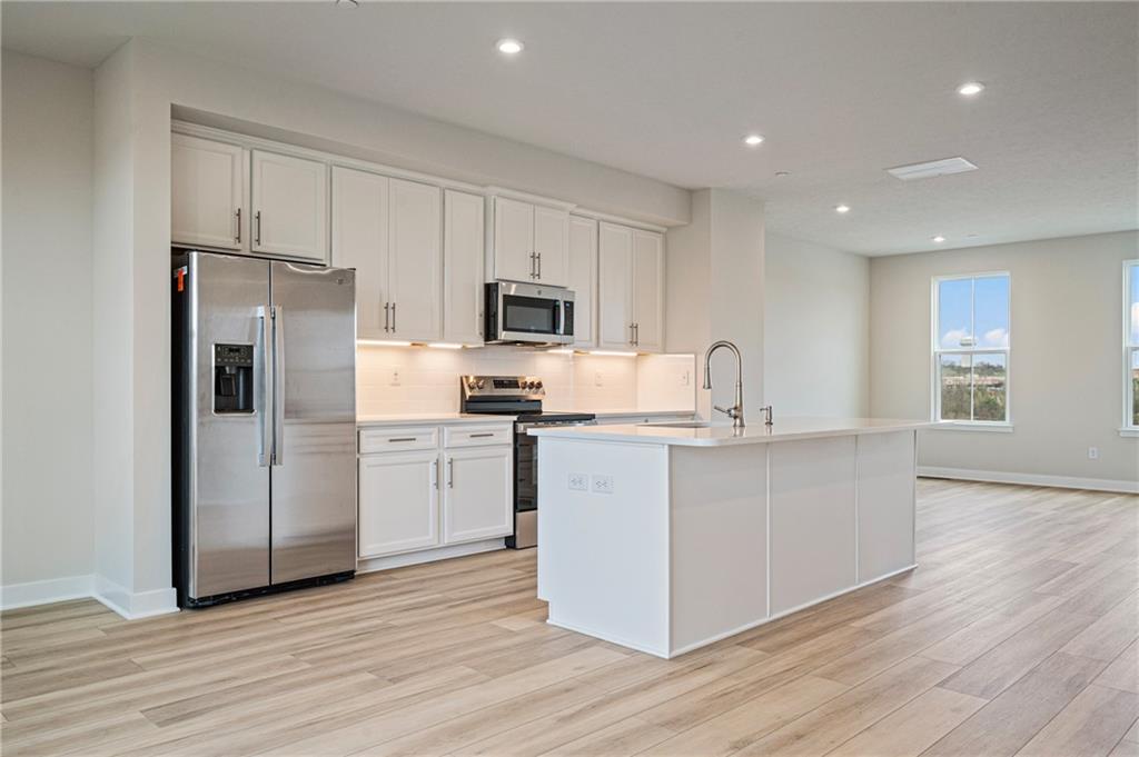 106 Scenic Ridge Drive Venetia, PA 15367 - Photo 18 of 32 a kitchen with white cabinets and stainless steel appliances