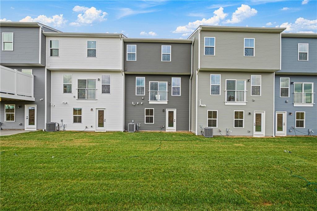 106 Scenic Ridge Drive Venetia, PA 15367 - Photo 31 of 32 a large building with a big yard and more windows
