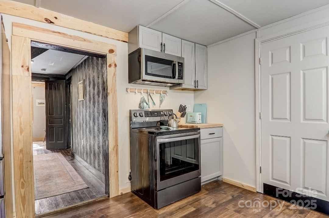 14 Old Mater Farm Road Sylva, NC 28779 - Photo 12 of 26 a kitchen with a stove and a microwave