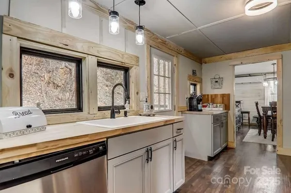 a kitchen with sink cabinets and window