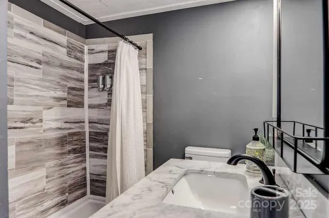 a bathroom with a sink and mirror