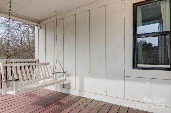 a view of a porch with wooden floor