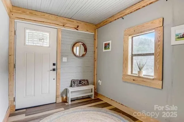 a view of a door and a window in a room