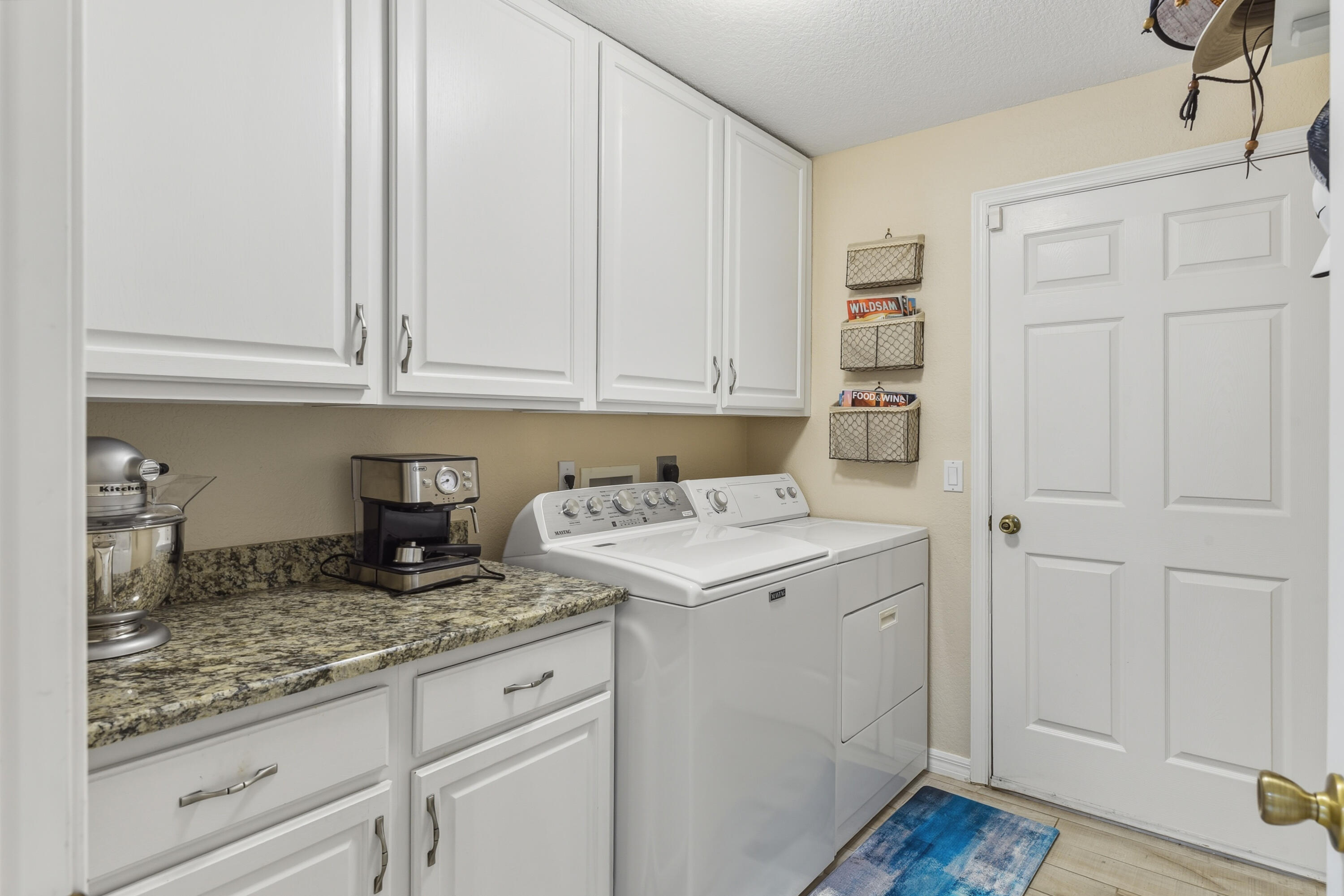 4891 Southeast Pompano Terrace Stuart, FL 34997 - Photo 44 of 57 Inside laundry with storage