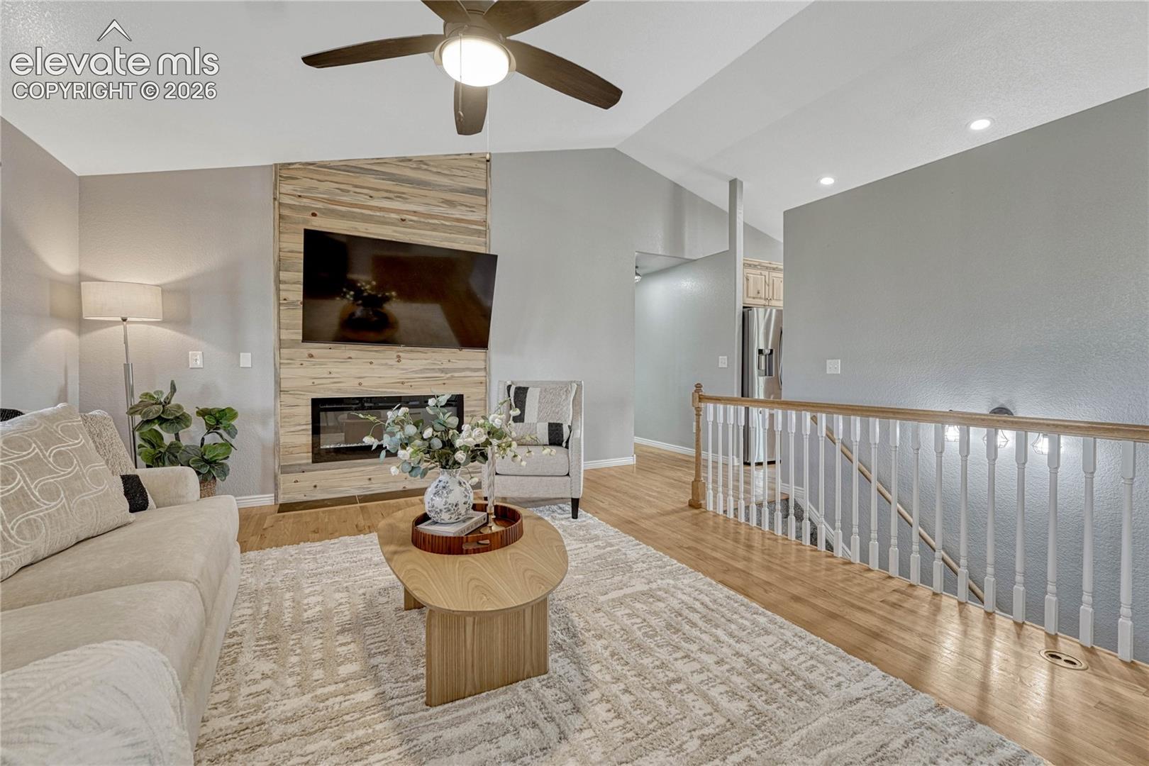13695 Woodlake Road Elbert, CO 80106 - Photo 7 of 39 ...and electric fireplace with cozy cabin-style wood surround.