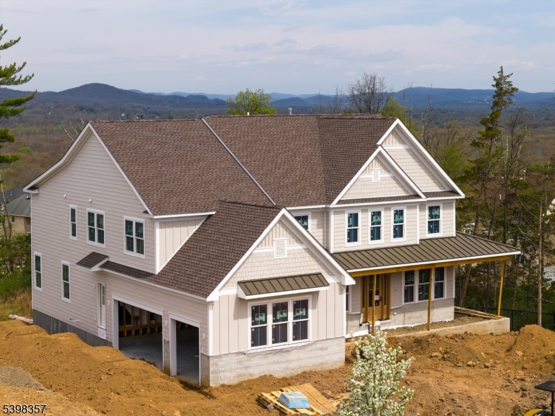 44 Roome Road Montville, NJ 07082 - Photo 4 of 9 a front view of a house with a yard