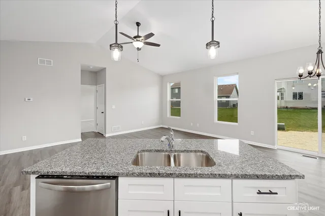 a view of a room with a ceiling fan