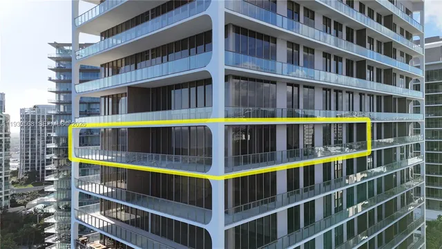 a view of building with large windows and a big yard