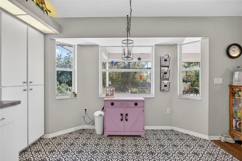a room with window and chandelier