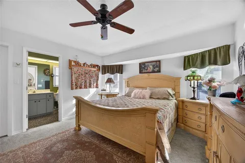 a bed room with a bed and a chandelier