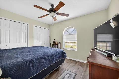 a bedroom with a large bed and a window