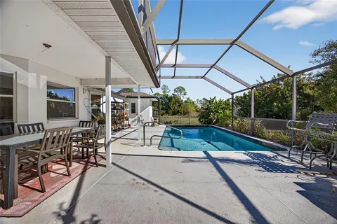 a view of a swimming pool with a patio