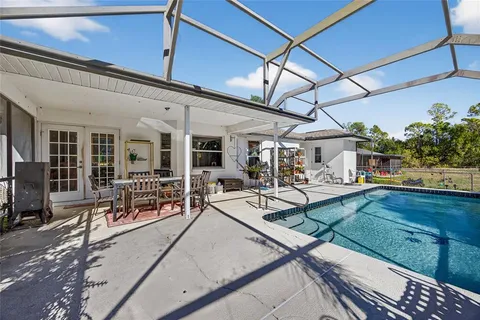 a view of a swimming pool with a patio