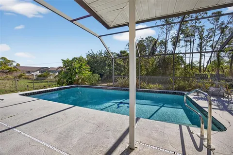 a view of a balcony with yard