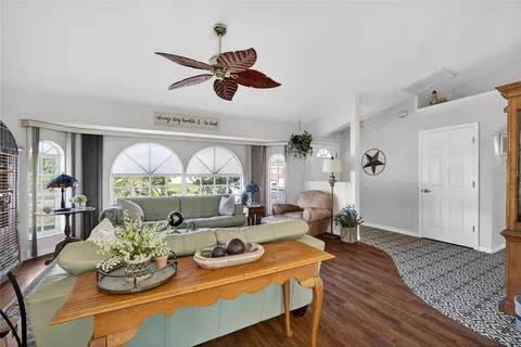 a living room with kitchen island furniture and a large window
