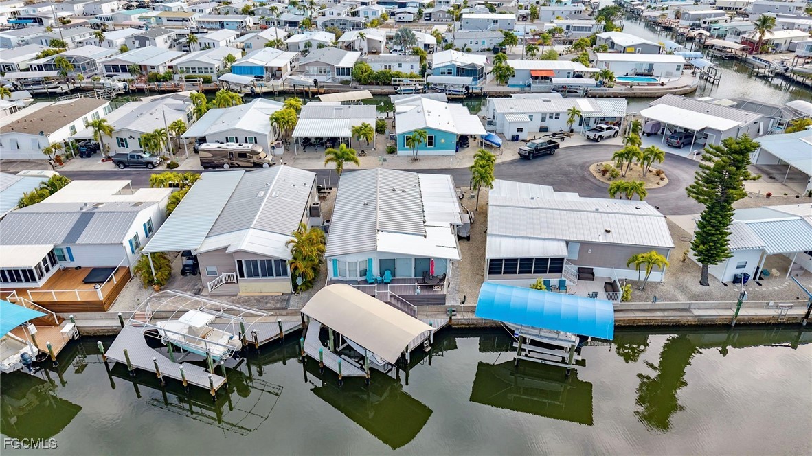 2991 Sloop Lane St. James City, FL 33956 - Photo 17 of 43 a aerial view of a swimming pool and lounge chairs