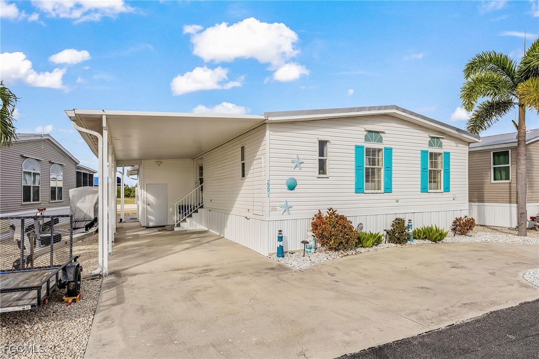 2991 Sloop Lane St. James City, FL 33956 - Photo 2 of 43 a view of a house with a patio