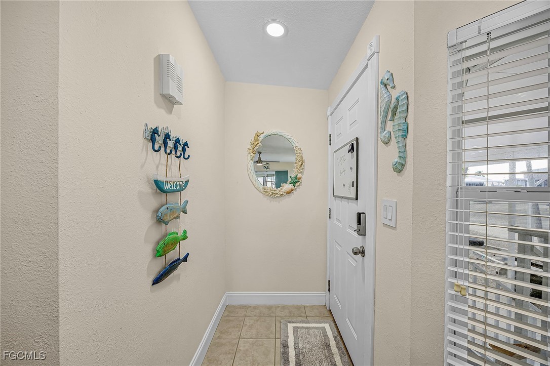 2991 Sloop Lane St. James City, FL 33956 - Photo 23 of 43 wooden floor in a gallery with a window