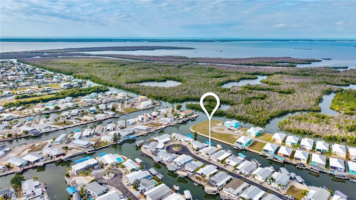 2991 Sloop Lane St. James City, FL 33956 - Photo 30 of 43 a view of a swimming pool with a yard