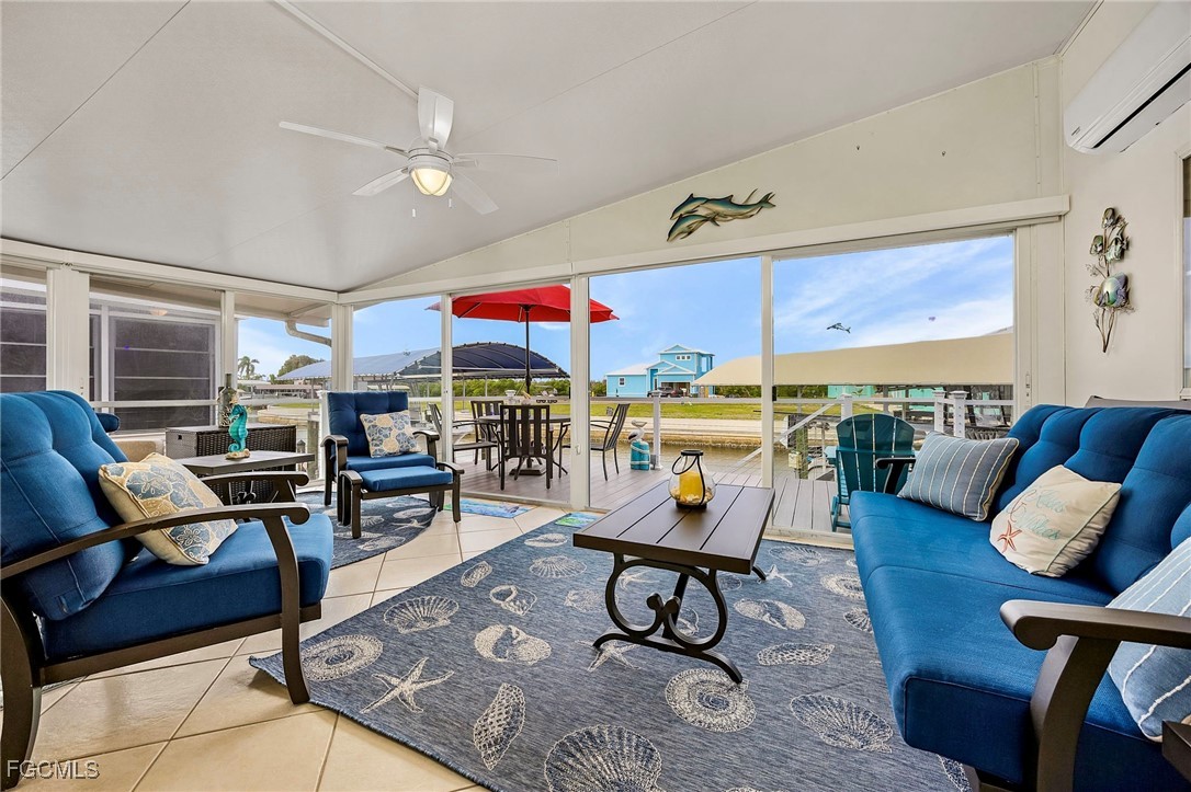 2991 Sloop Lane St. James City, FL 33956 - Photo 3 of 43 a living room with furniture and a table