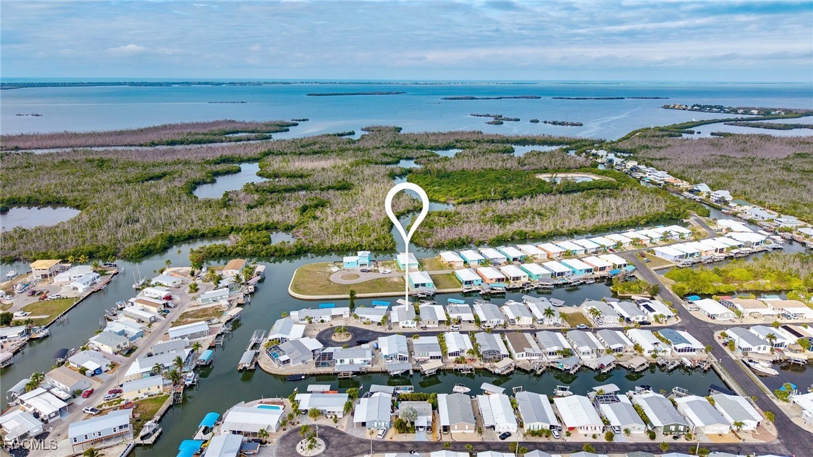2991 Sloop Lane St. James City, FL 33956 - Photo 32 of 43 a view of a swimming pool with outdoor seating