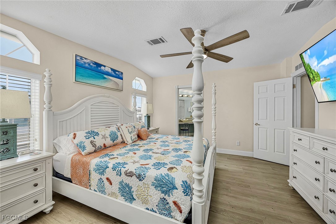 2991 Sloop Lane St. James City, FL 33956 - Photo 38 of 43 a bedroom with a bed and a window