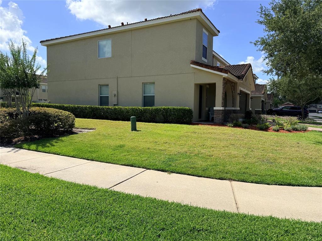 2084 Water Tupelo Way Ocoee, FL 34761 - Photo 23 of 34 a front view of a house with a yard