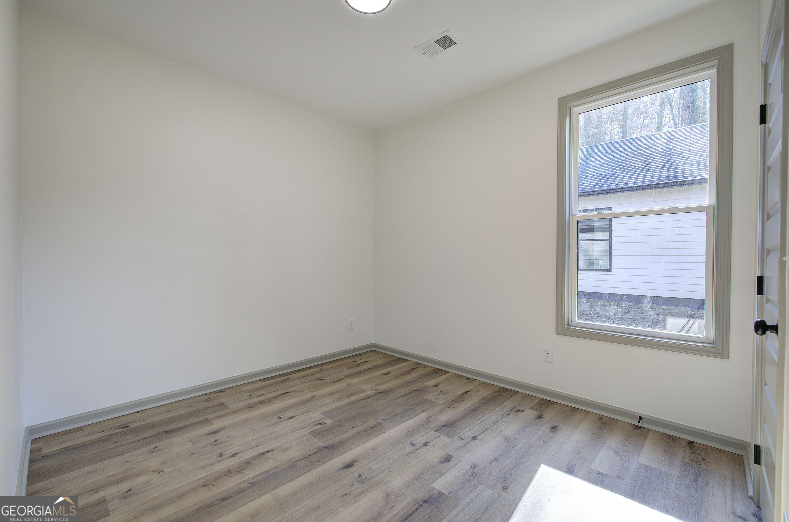 115 East Boundary Rome, GA 30161 - Photo 13 of 34 an empty room with a window