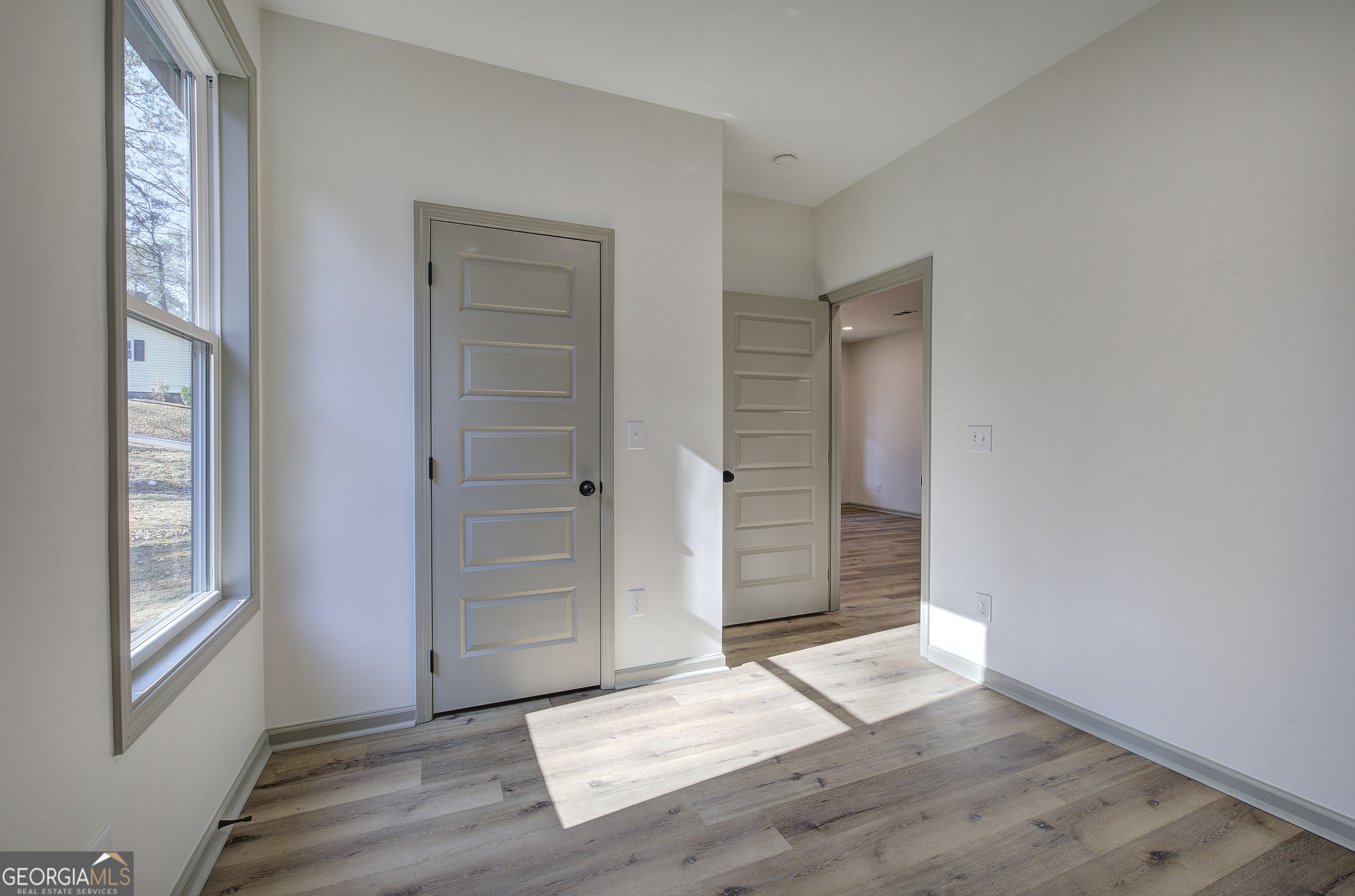 115 East Boundary Rome, GA 30161 - Photo 14 of 34 an empty room with window and wooden floor