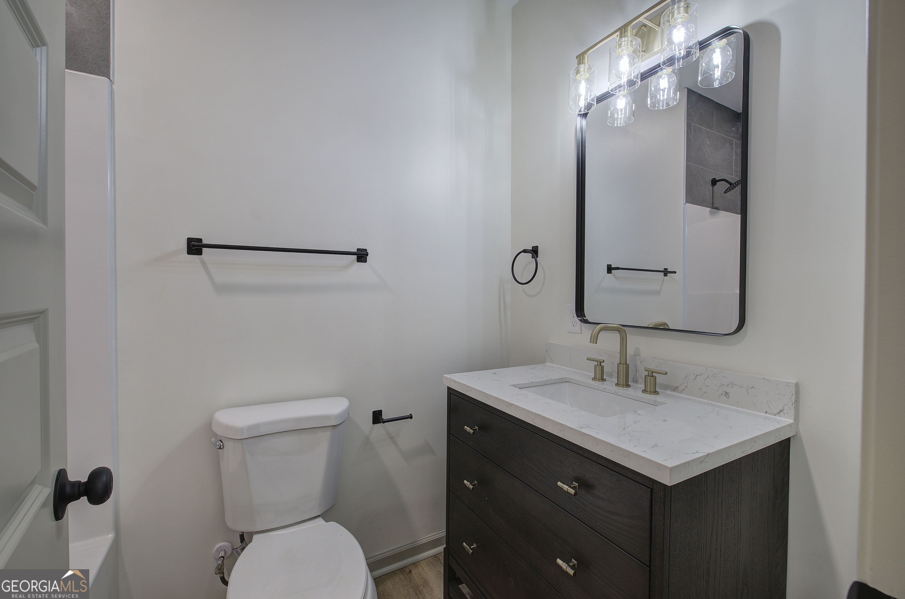 115 East Boundary Rome, GA 30161 - Photo 15 of 34 a bathroom with a toilet sink and mirror