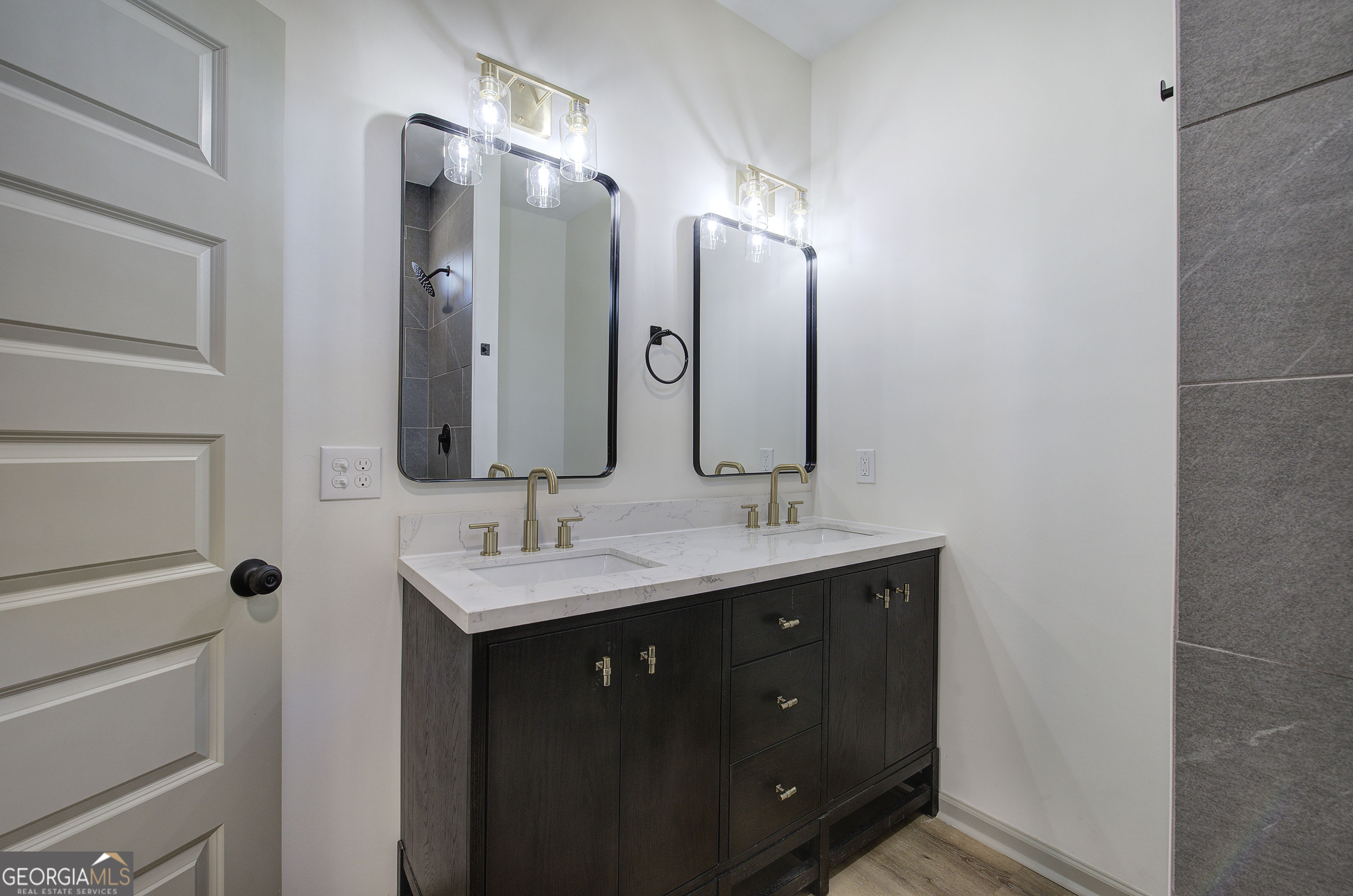 115 East Boundary Rome, GA 30161 - Photo 25 of 34 a bathroom with a double vanity sink and mirror