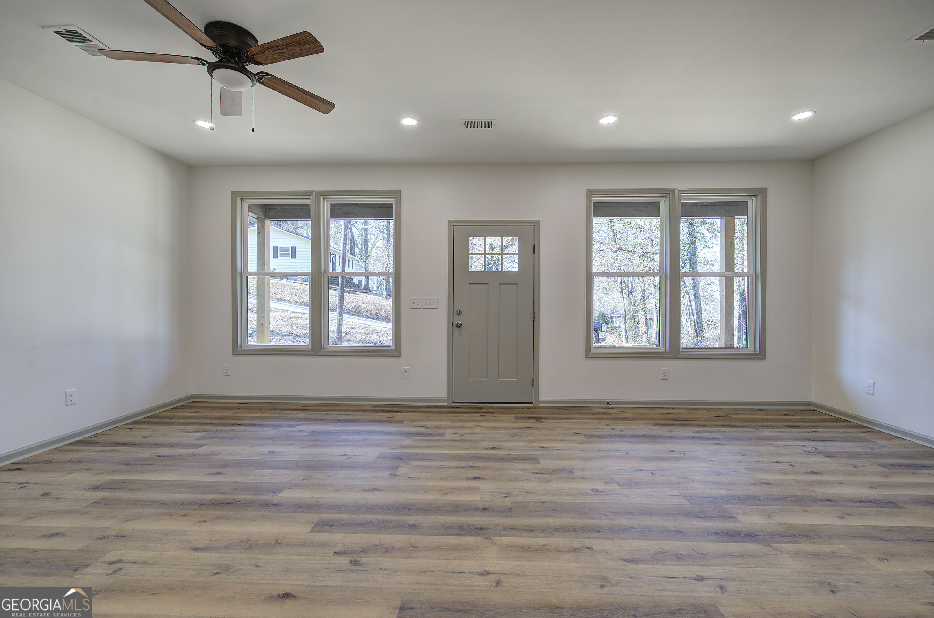 115 East Boundary Rome, GA 30161 - Photo 5 of 34 a view of an empty room with window and wooden floor