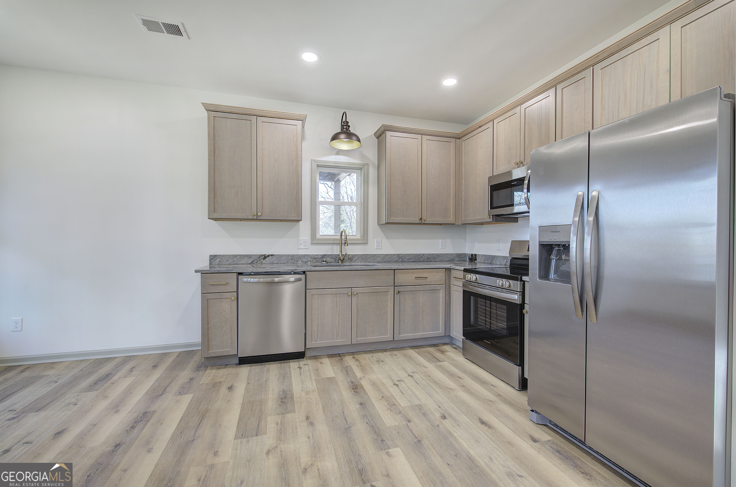 115 East Boundary Rome, GA 30161 - Photo 6 of 34 a kitchen with kitchen island a counter top space cabinets and stainless steel appliances