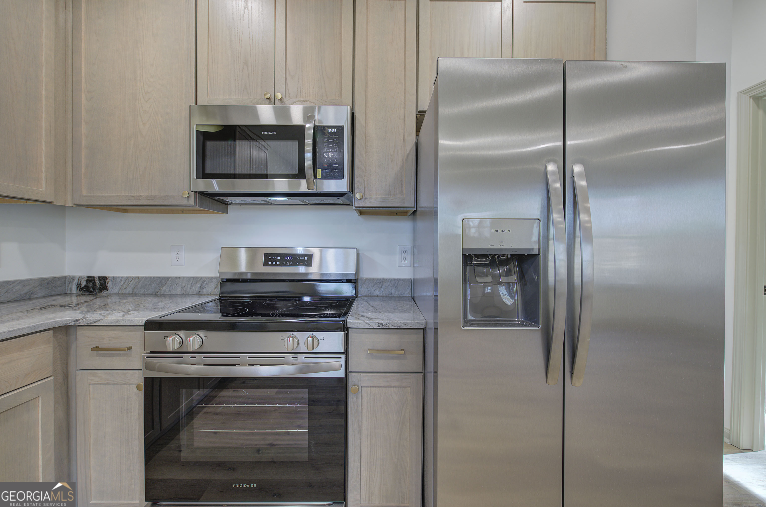 115 East Boundary Rome, GA 30161 - Photo 9 of 34 a kitchen with a stove and a refrigerator