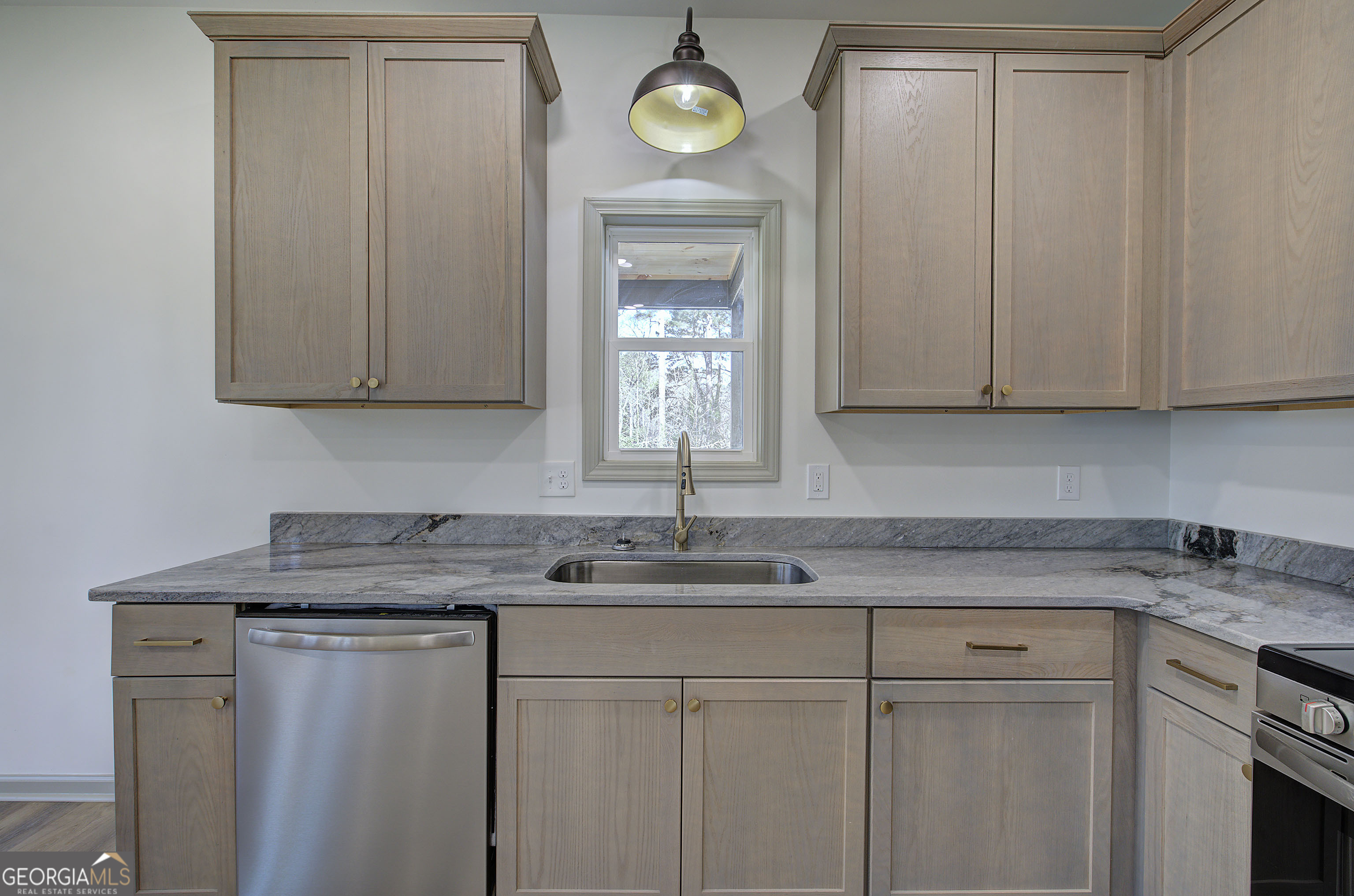 115 East Boundary Rome, GA 30161 - Photo 10 of 34 a kitchen with cabinets stainless steel appliances and a sink