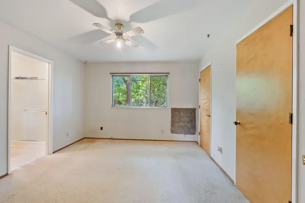 a view of an empty room with a window