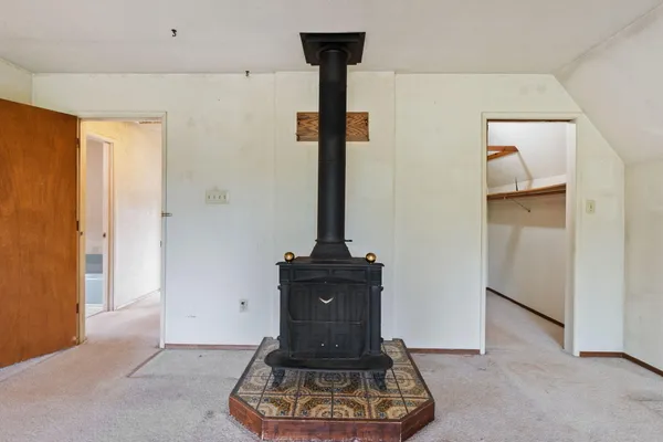 a view of an empty room with a garage