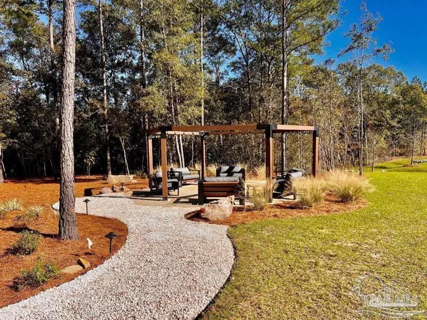 a view of a swimming pool with some sitting area